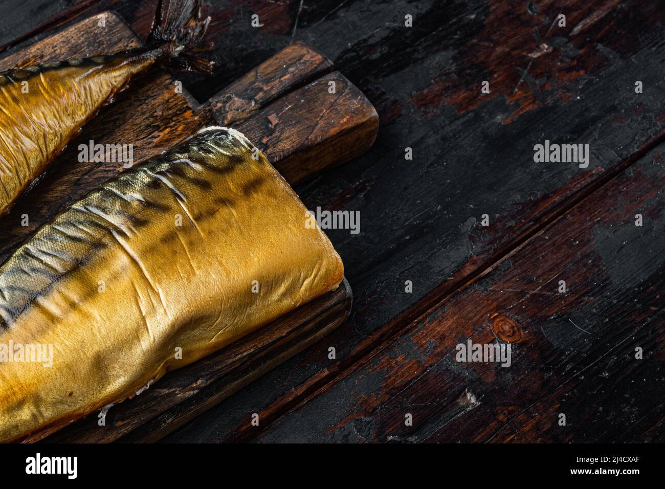 Set of smoked fish mackerel, on old dark wooden table background Stock ...