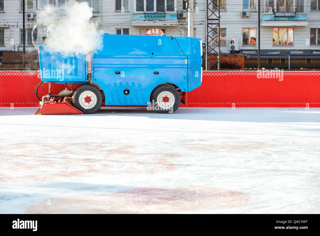An ice cleaning machine polishes the ice rink at the stadium Stock