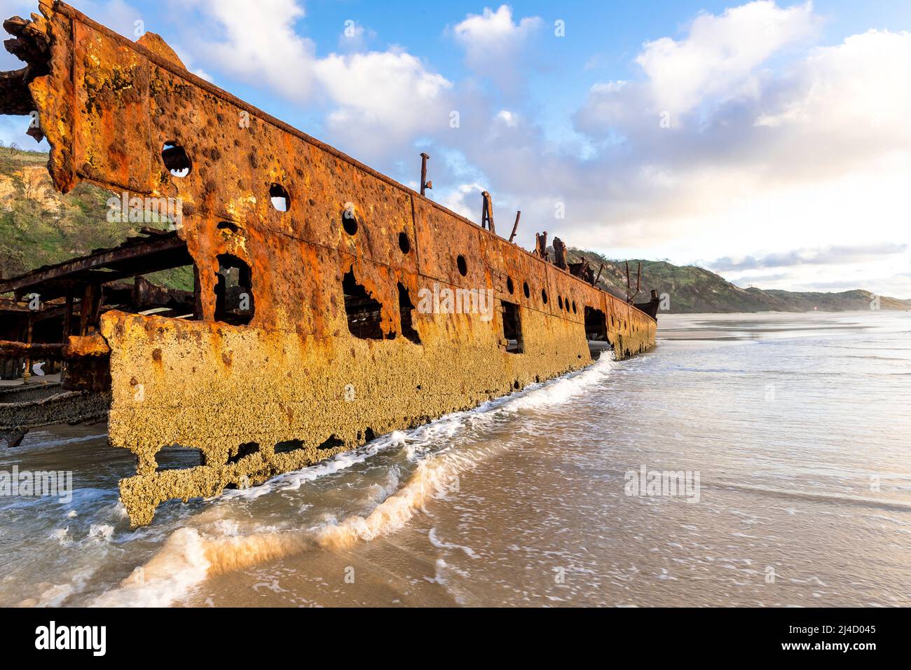 Starboard side of Maheno shipwreck, early morning on Seventy Five Mile Beach, Fraser Island, Queensland, Australia Stock Photo