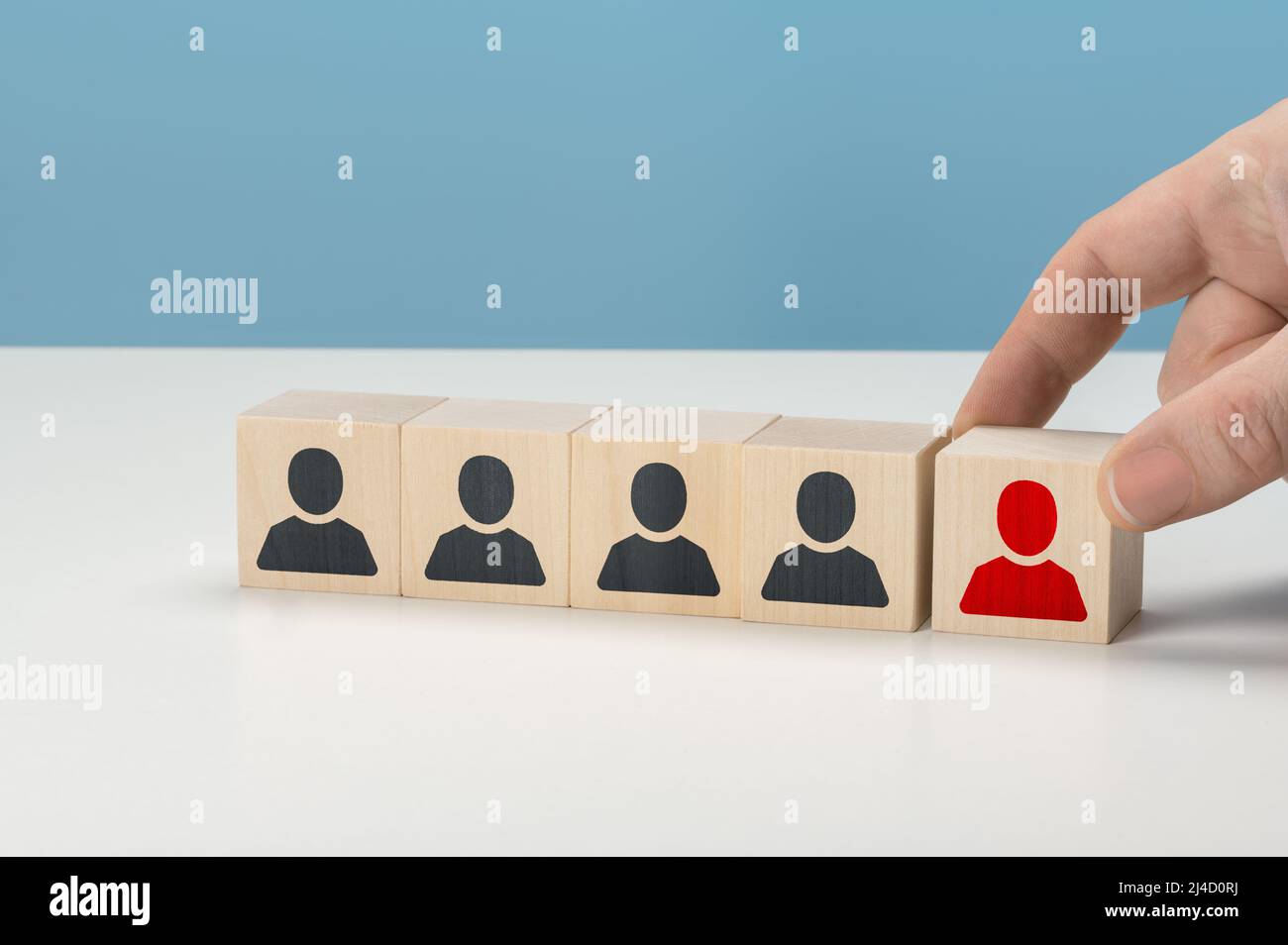 HR, Human resources and team completing. Human Resources and personnel hiring concept. Employees are represented by wooden cubes with icons. Business Stock Photo