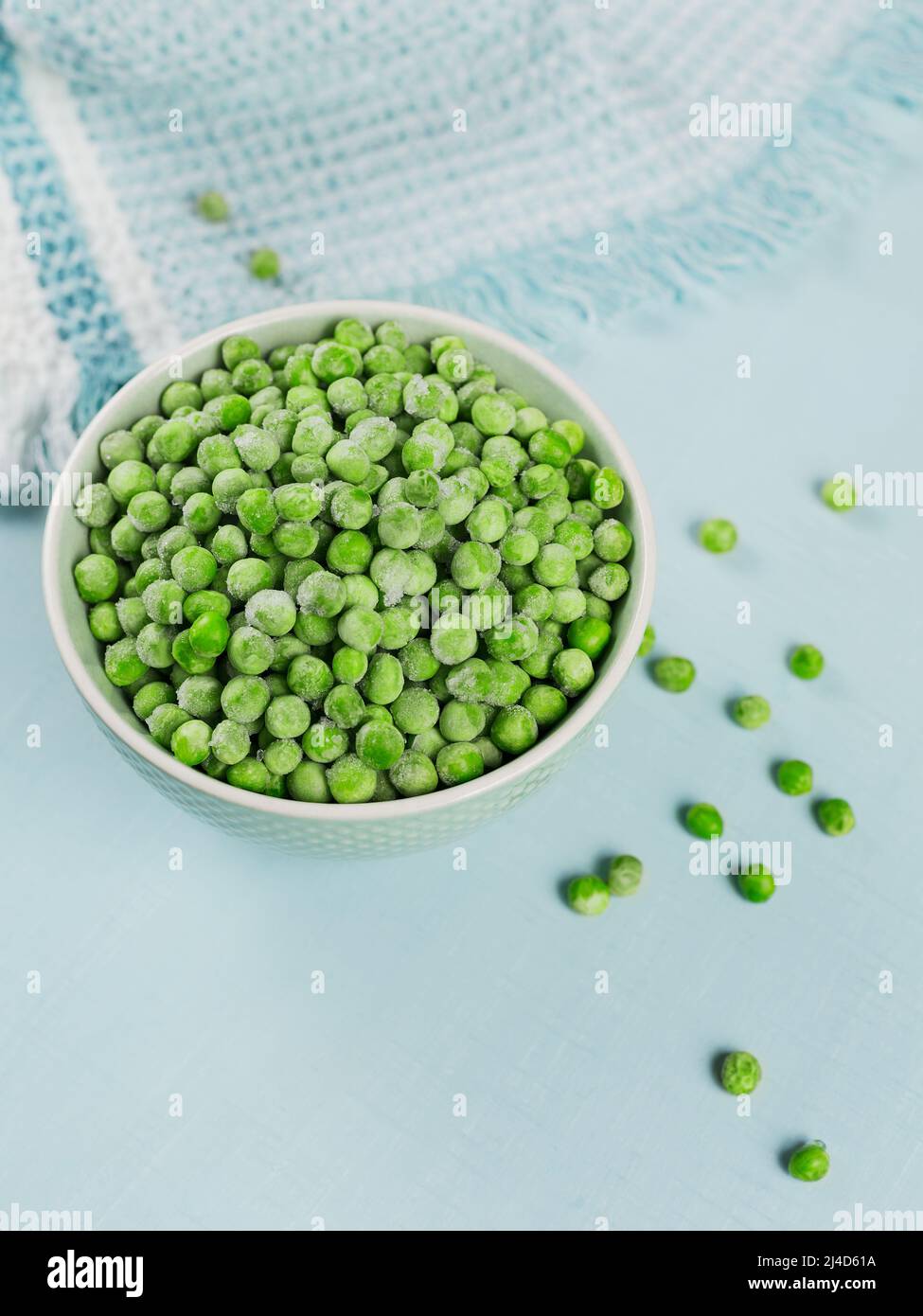 Composition with organic frozen vegetables on a light blue background Stock Photo