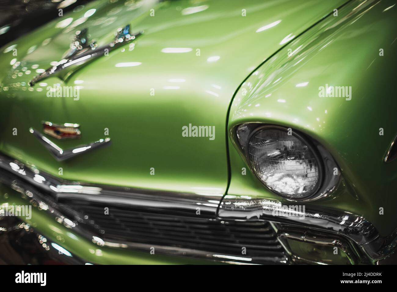 Izmir, Turkey - December 4, 2021: Close up shot of a green colored Chevrolet brand classic cars headlight at the exhibition of classic cars Izmir fair Stock Photo