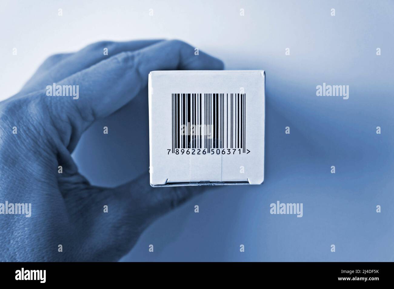 Barcode on medicine box in blue tones Stock Photo - Alamy
