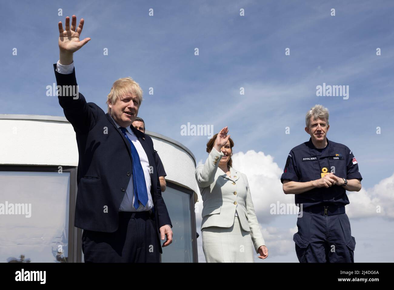 (Left-right) Prime Minister Boris Johnson, MP for Dover Natalie Elphicke and John Craig, Deputy Commander and Chief of Staff to the Commander of the UK Carrier Strike Group at Royal Navy stand overlooking the channel in Dover, Kent. Picture date: Thursday April 14, 2022. Stock Photo