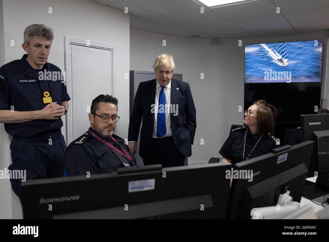 Prime Minister Boris Johnson (second right) visits the command room at