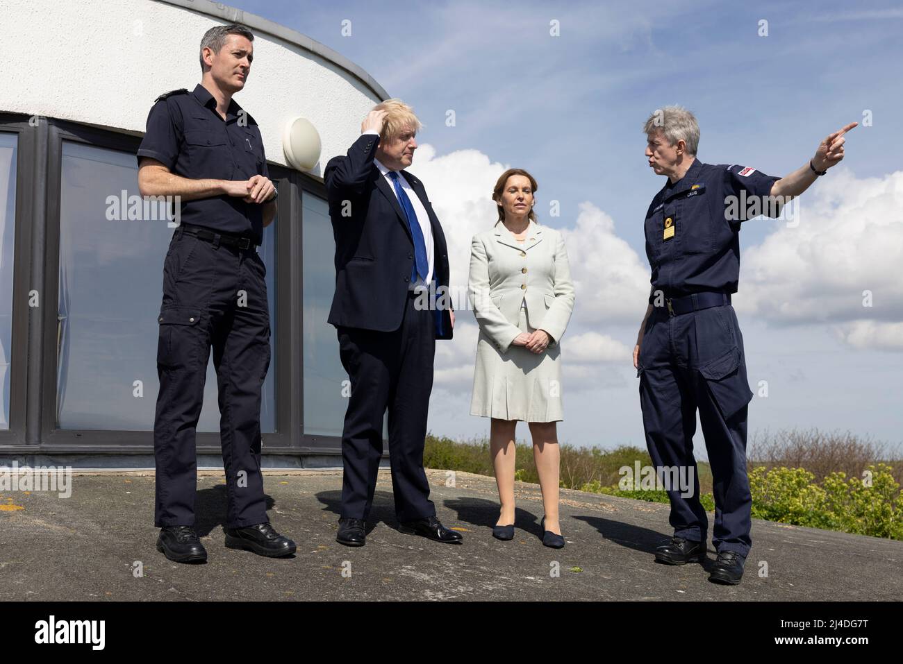 (Left-right) Dan O' Mahoney, the Clandestine Channel Threat Commander, Prime Minister Boris Johnson, MP for Dover Natalie Elphicke and John Craig, Deputy Commander and Chief of Staff to the Commander of the UK Carrier Strike Group at Royal Navy stand overlooking the channel in Dover, Kent. Picture date: Thursday April 14, 2022. Stock Photo