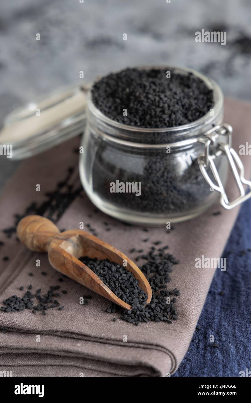 Indian spice Black cumin (nigella sativa or kalonji) seeds glass jar
