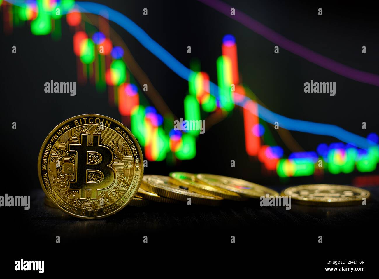 Golden bitcoin cryptocurrency at trading chart background Stock Photo ...