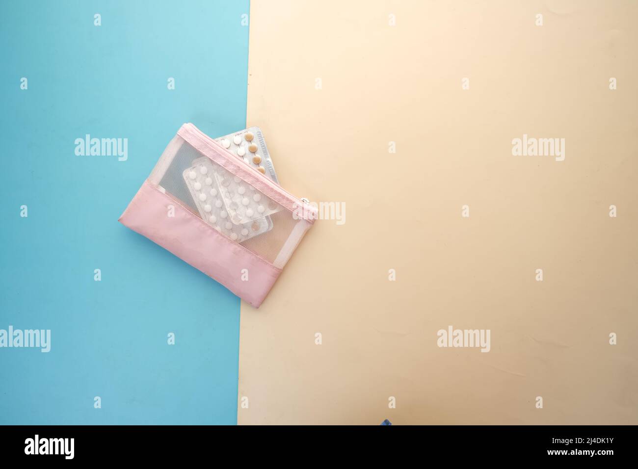 birth control pills on wooden background, top view  Stock Photo