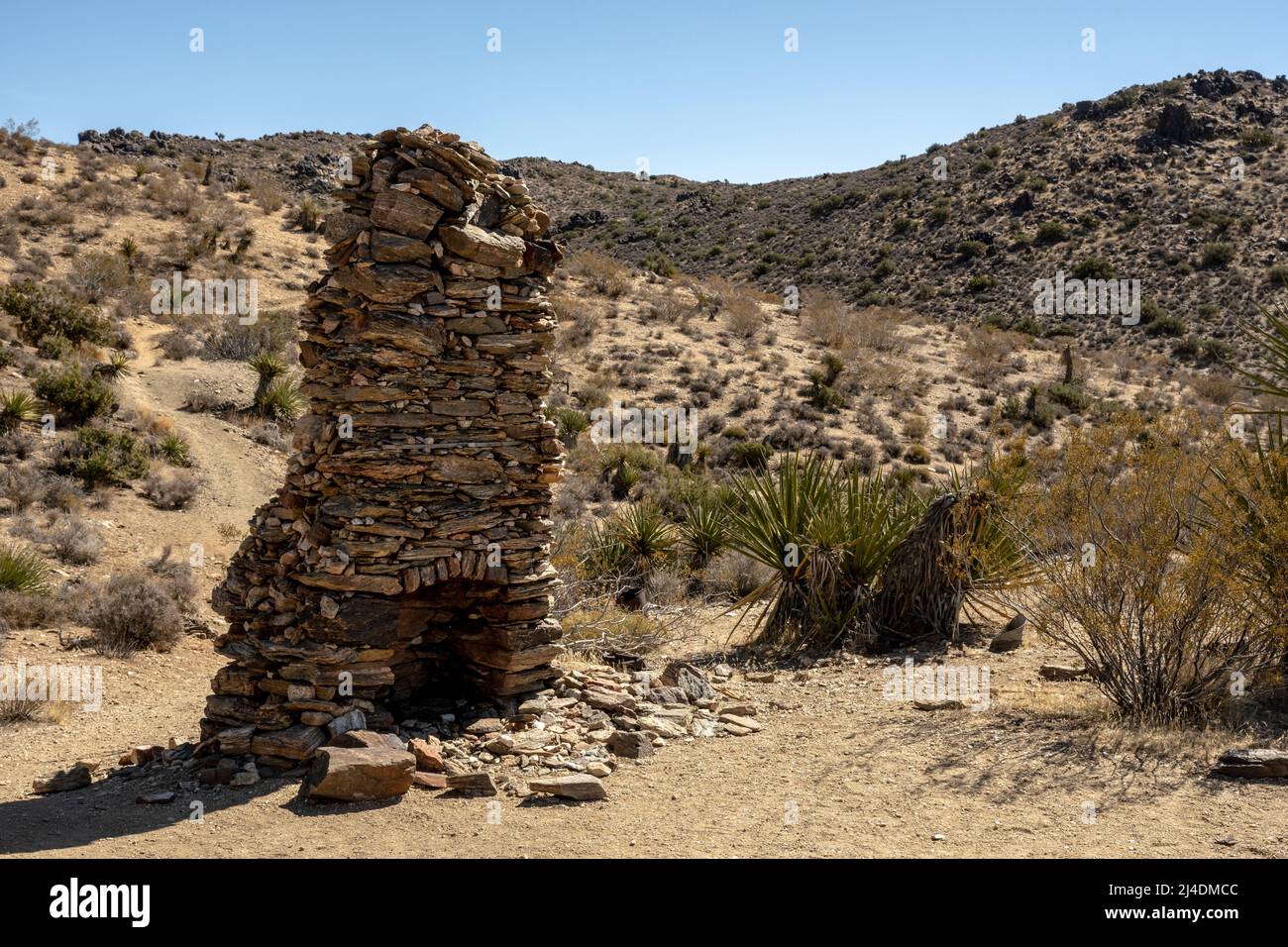 Stacked Stone Fireplace Stands Alone In The Hills of Joshua Tree National Park Stock Photo