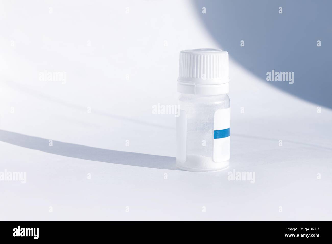 Yogurt starter cultures in medicine bottle on white background. Lactobacillus bulgaricus, Streptococcus thermophilus. Ferments lactose milk sugar, lac Stock Photo