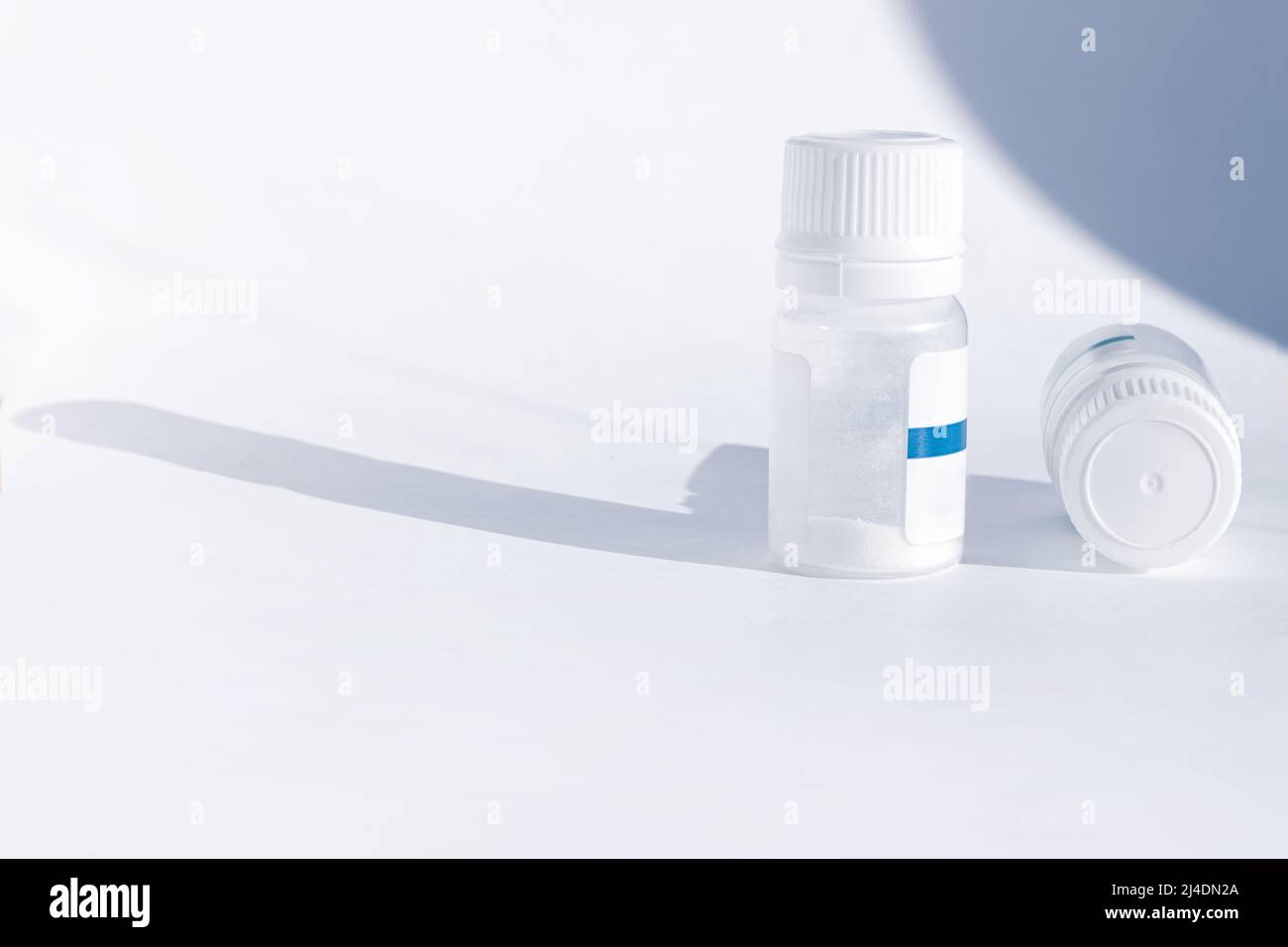 Yogurt starter cultures in medicine bottle on white background. Lactobacillus bulgaricus, Streptococcus thermophilus. Ferments lactose milk sugar, lac Stock Photo