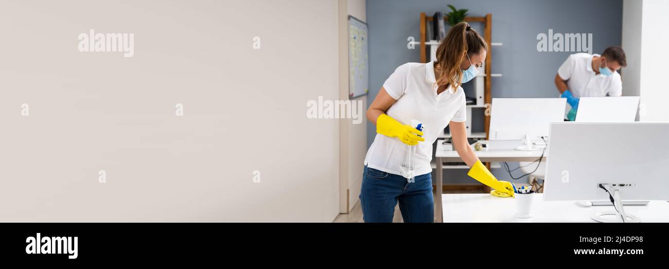 Professional Office Cleaning Services With Face Masks Stock Photo