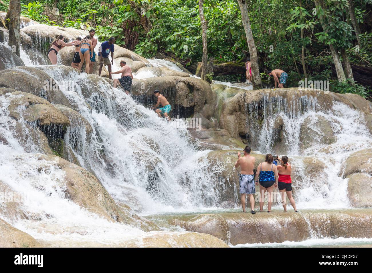 Tourists climbing Dunns River Falls, Ocho Rios, St Ann Parish, Jamaica, Greater Antilles, Caribbean Stock Photo