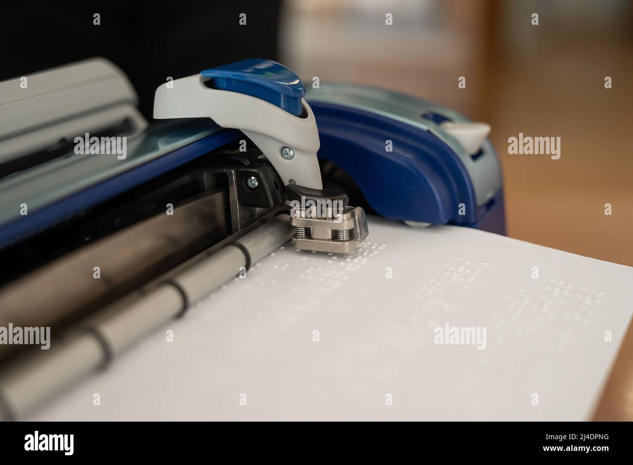 Closeup of a braille code printing machine Stock Photo Alamy