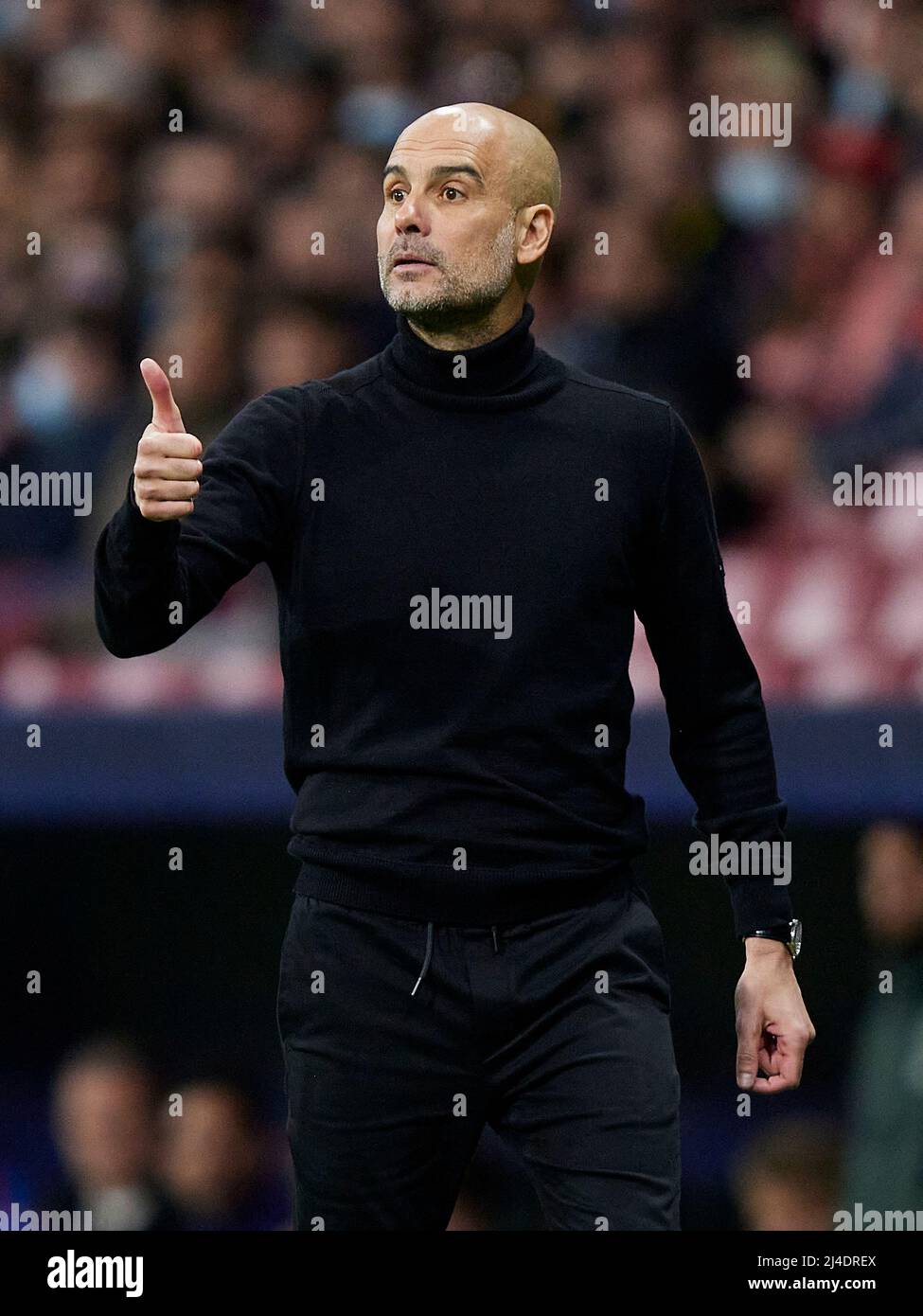 Manchester City head coach Pep Guardiola    during the UEFA Champions League match, Quarter Final, Second Leg, between Atletico de Madrid and Manchester City played at Wanda Metropolitano Stadium on April 13, 2022 in Madrid, Spain. (Photo by Ruben Albarran / PRESSINPHOTO) Stock Photo