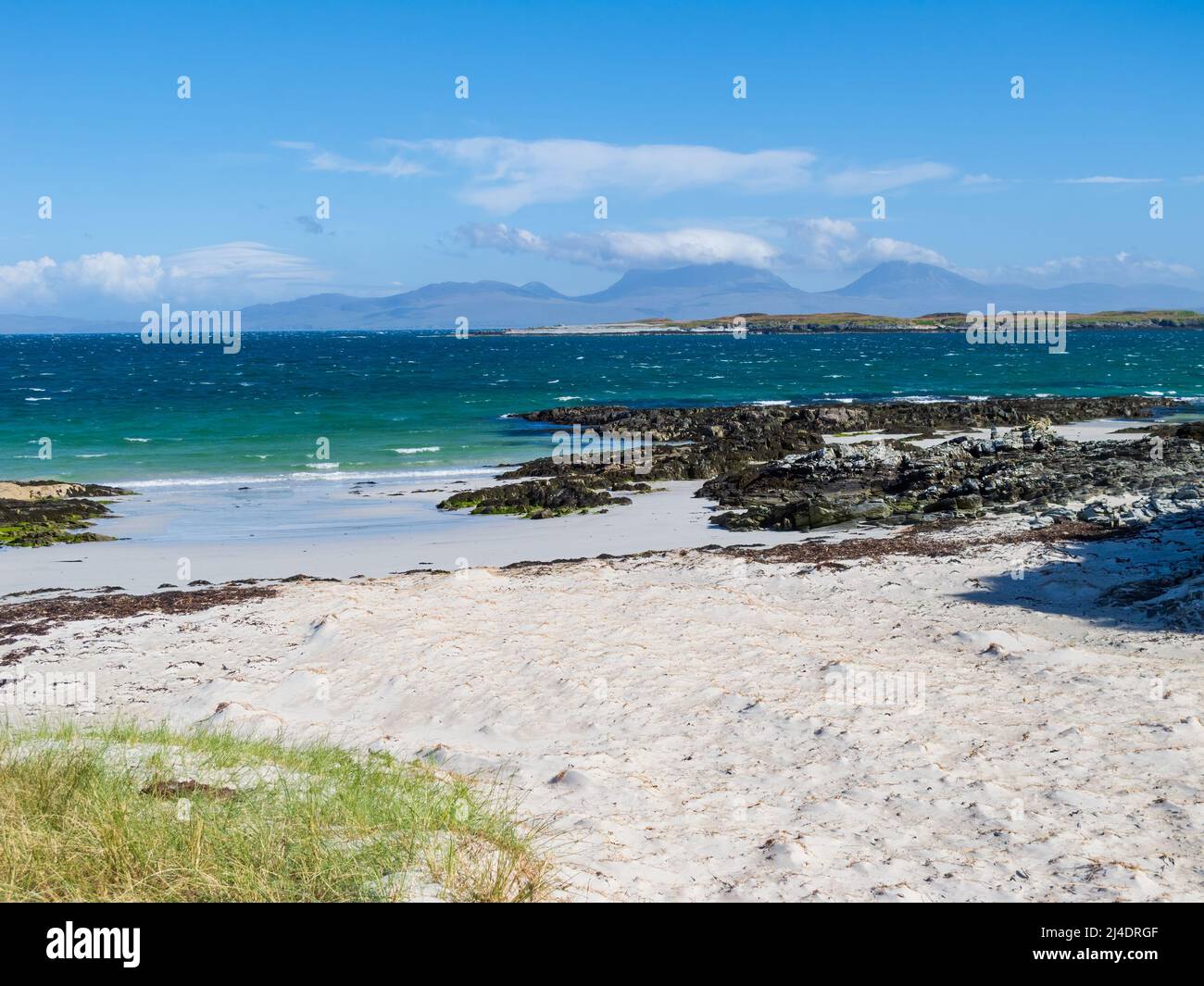 The Paps of Jura from near Seal Cottage on Oronsay, The Inner Hebrides of Scotland Stock Photo