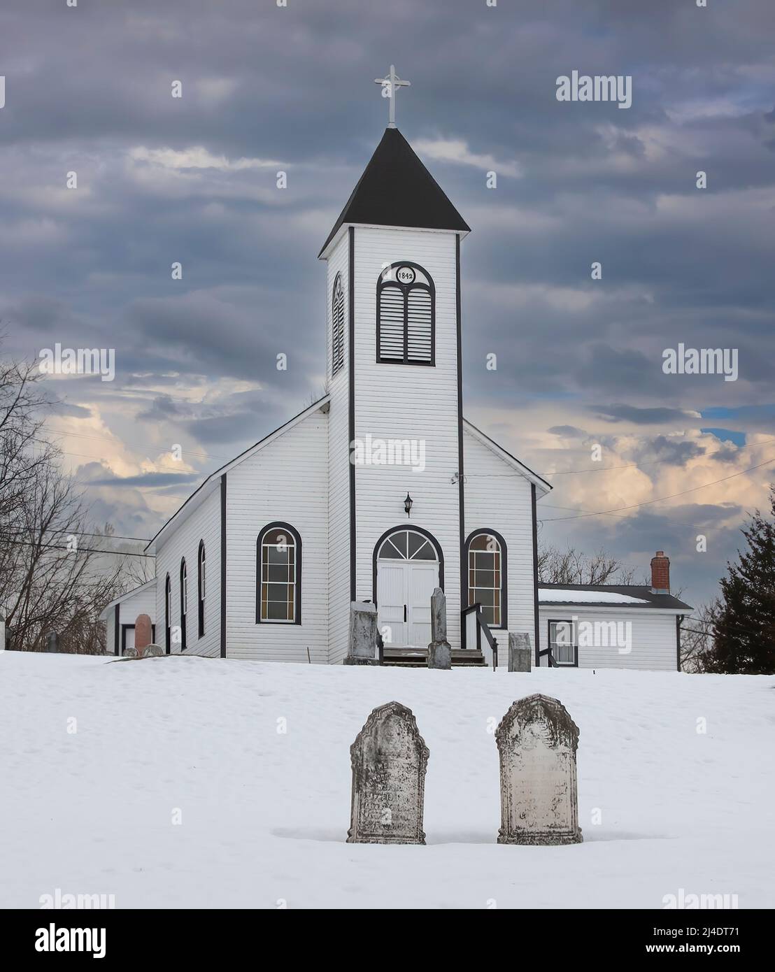 An old wooden church at sunset on a cold winter day in rural Canada Stock Photo