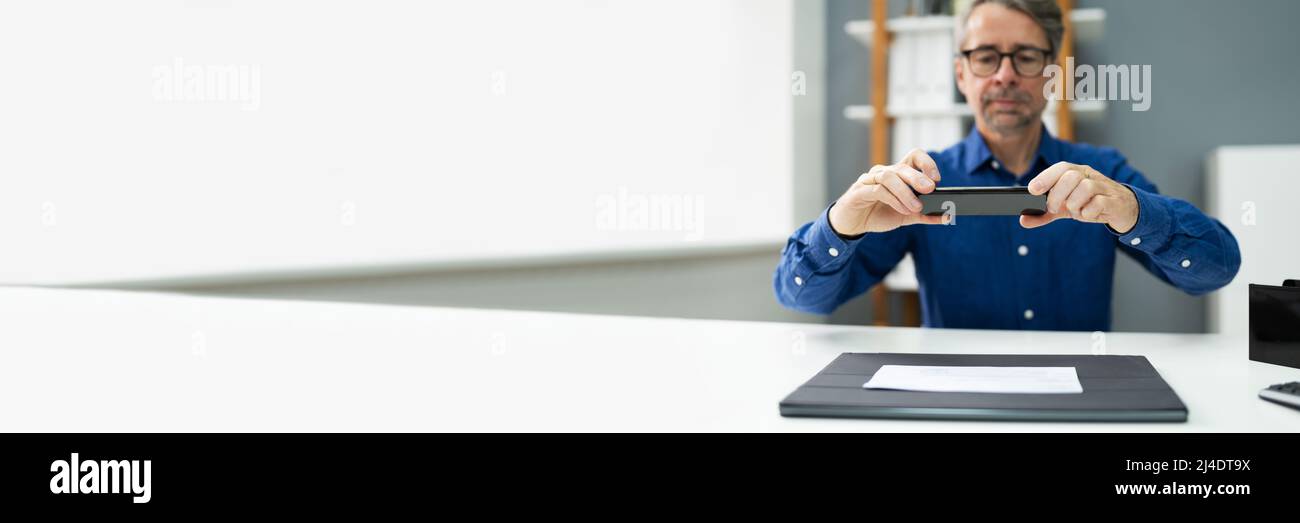 Remote Check Deposit Using Mobile Photo. Scanning Documents With Phone Stock Photo