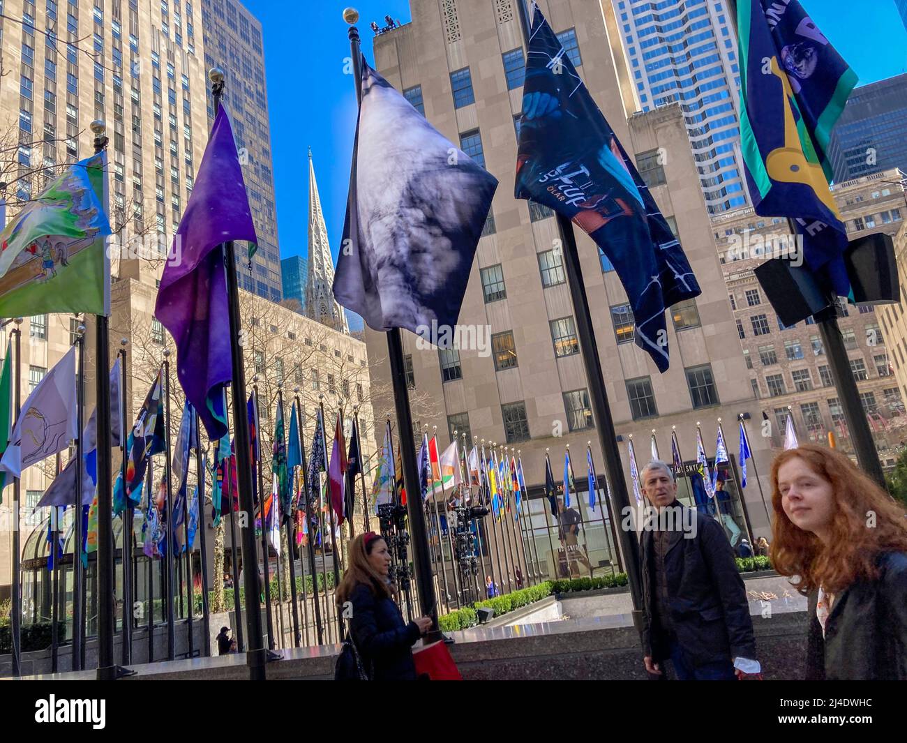 The 193 flags surrounding the rink at Rockefeller Center in New York on Friday, April 1, 2022 showcase the work of individuals who designed flags according to the theme “Only One Earth”. The collaboration  between the UN Environment Programme, the Climate Museum and Rockefeller Center showcases the 193 winning designs, all printed onto biodegradable flags. The flags will remain on display until May 6. (© Frances M. Roberts) Stock Photo