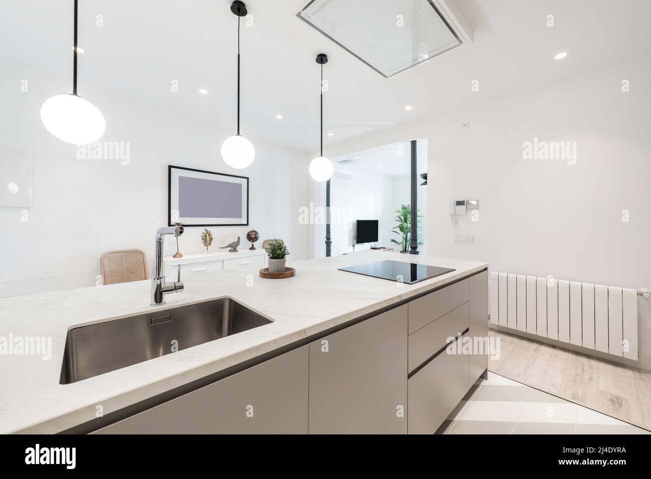 Kitchen island with builtin stainless steel sink with chrome tap