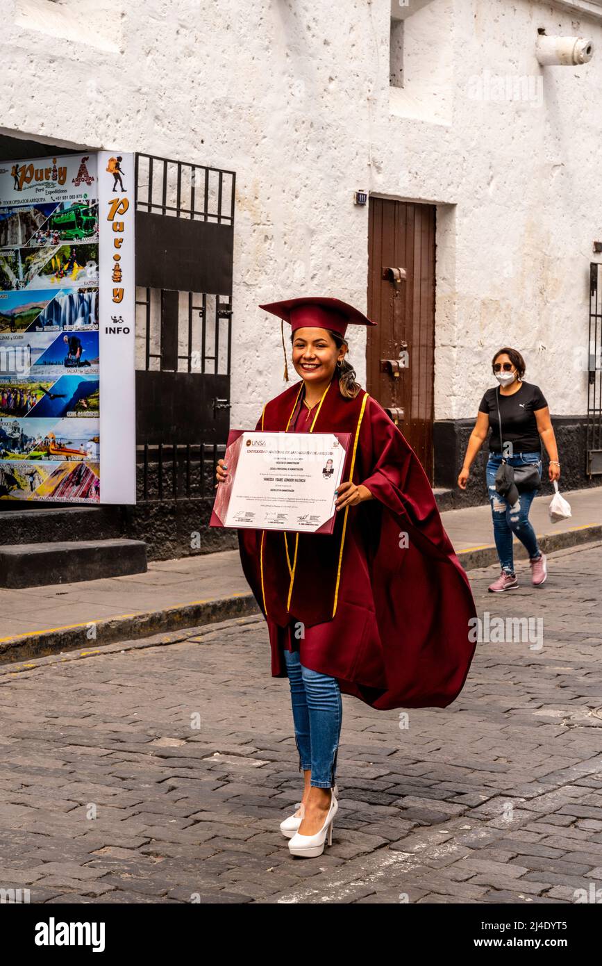 A Young Woman With Her Graduation Certificate Poses For A Photo In The City Of Arequipa, Arequipa Region, Peru. Stock Photo