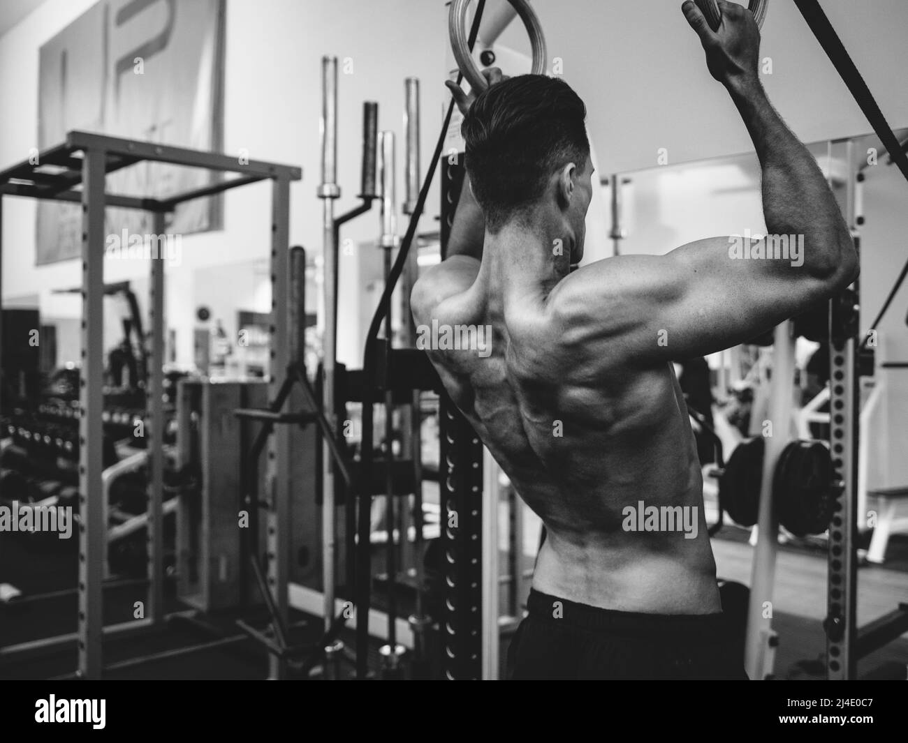 City Of London, London, UK - September 10, 2014: A man works out in a generic gym. He has a well-defined body. Stock Photo