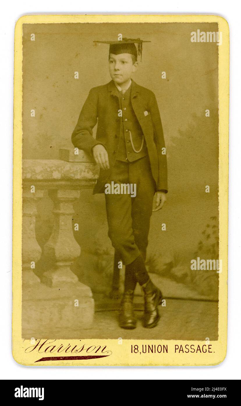 Original Victorian CDV (Carte de visite or visiting card) of confidant looking middle classed teenage Victorian boy, Victorian schooboy. wearing mortarboard from studio of J. Harrison, 18 Union Passage, Birmingham, U.K. Circa 1880 Stock Photo