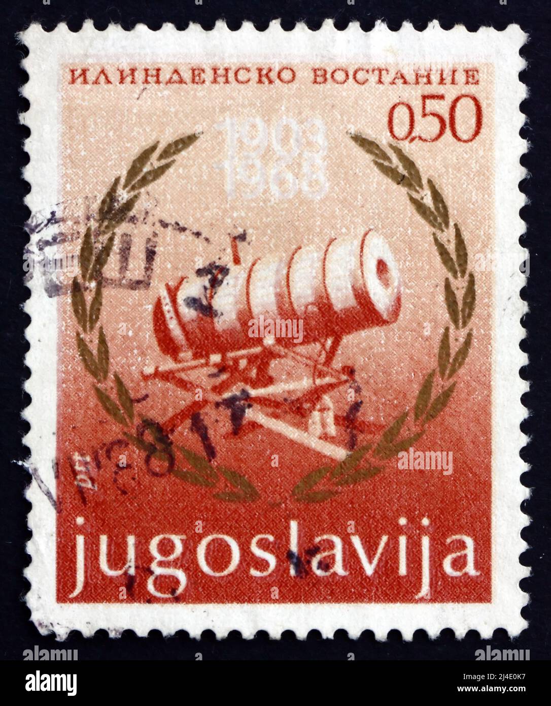 YUGOSLAVIA - CIRCA 1968: a stamp printed in the Yugoslavia shows Cannon and Laurel Wreath, 65th Anniversary of the Ilinden Uprising, Macedonia, circa Stock Photo