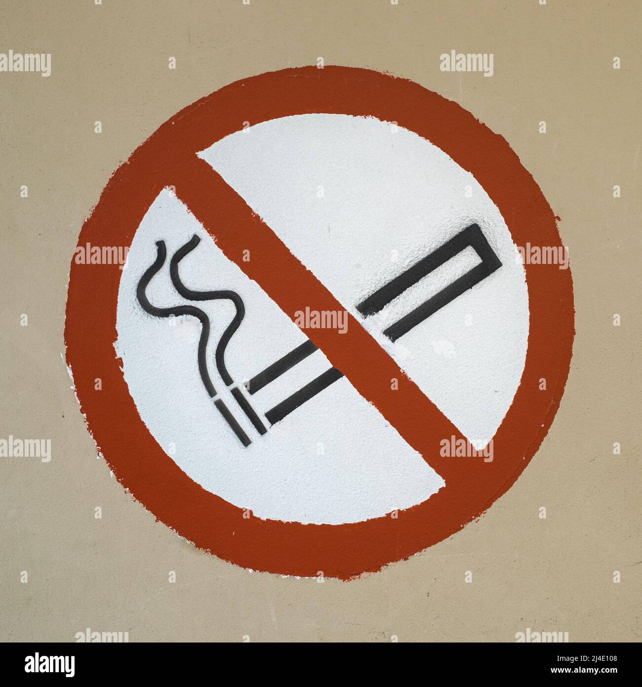 no smoking symbol spray and hand painted through stencil on a wall Stock Photo