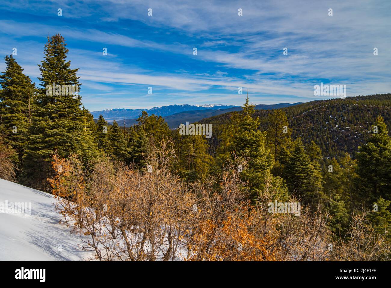 winter landscape driving towards Taos , New Mexico Stock Photo