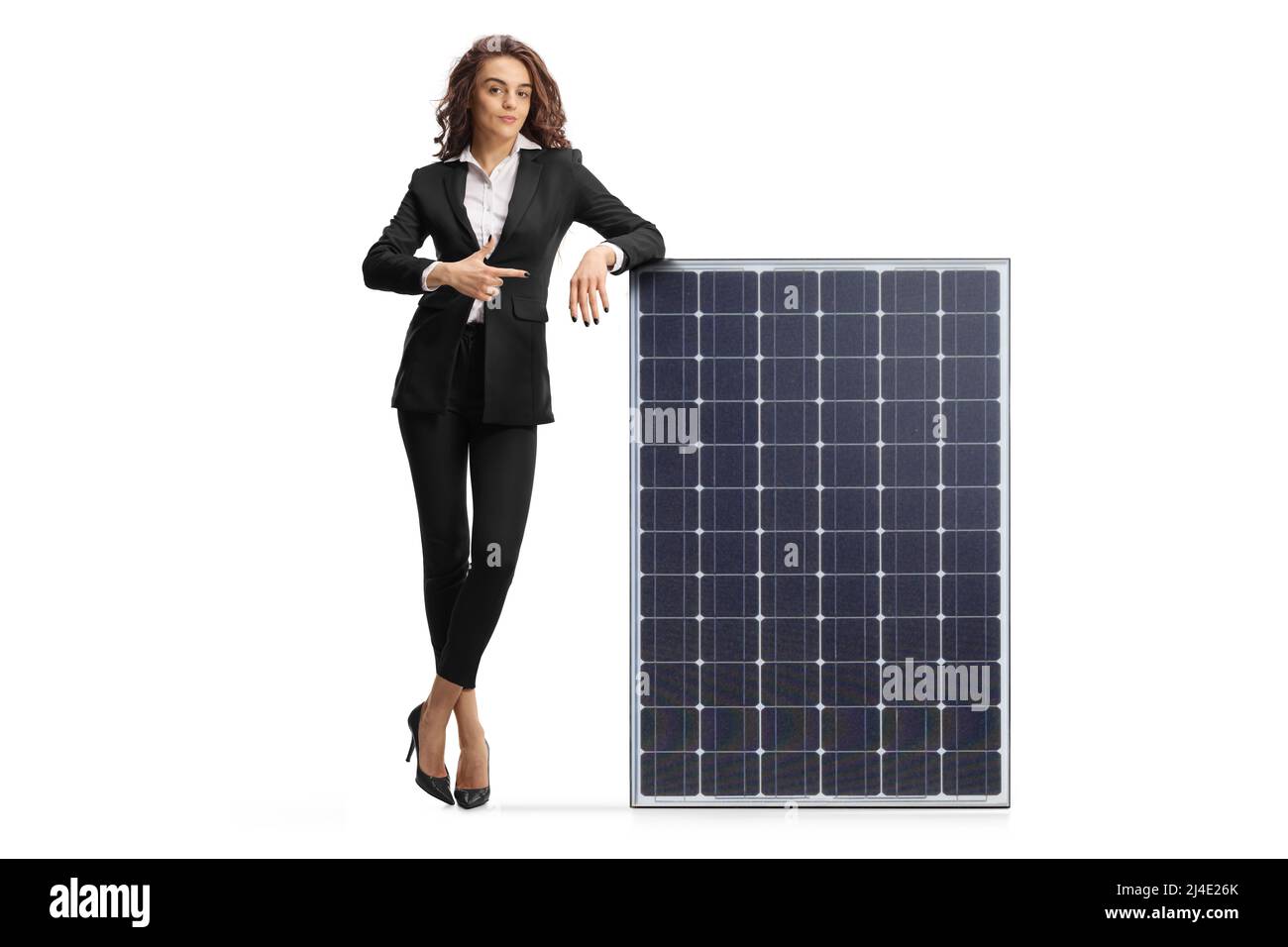 Full length portrait of a young businesswoman leaning on a solar panel ...