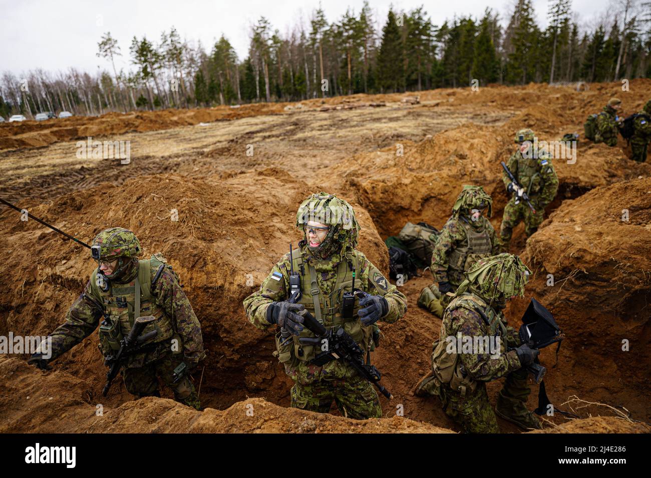 Estonian soldiers defend a dug-in position from attacking British armour and infantry in the Tapa central military training area in Estonia on NATO exercise Bold Dragon alongside Danish and French forces. Picture date: Thursday April 14, 2022. Stock Photo