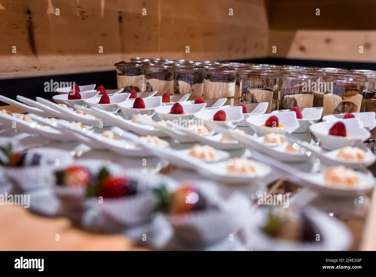 Various confectionery and chocolate pudding arranged on counter at ski resort Stock Photo