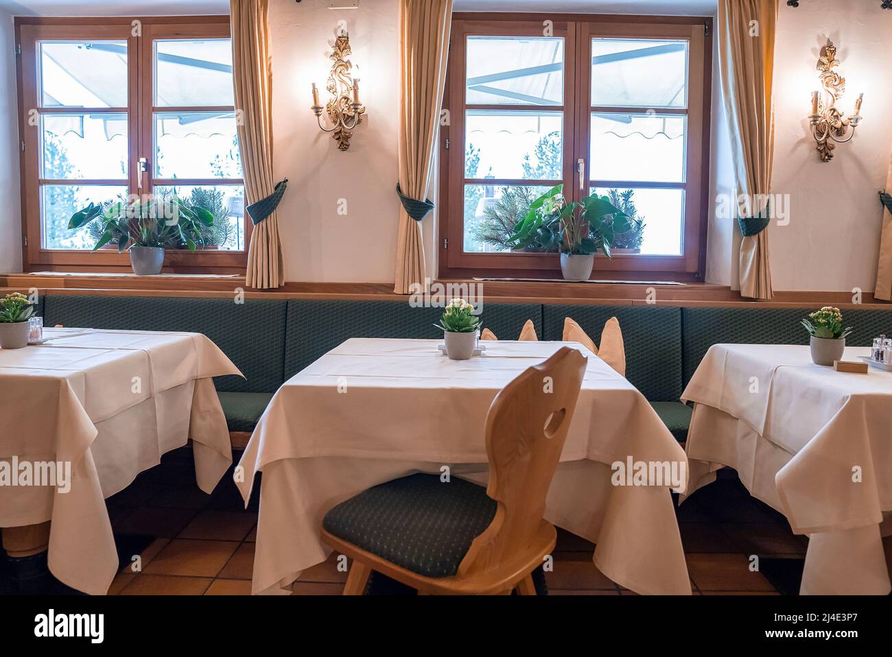 Interior of elegant illuminated dining area at luxurious ski resort Stock Photo