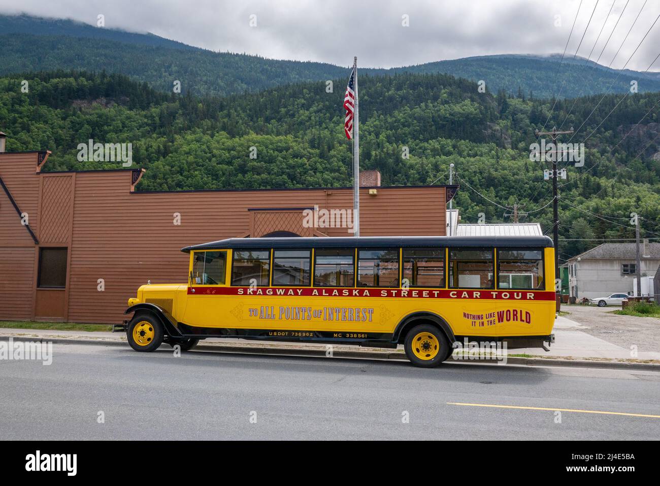 The Yellow Skagway Street Car Tour Bus Vehicle Parked In Skagway Alaska Stock Photo