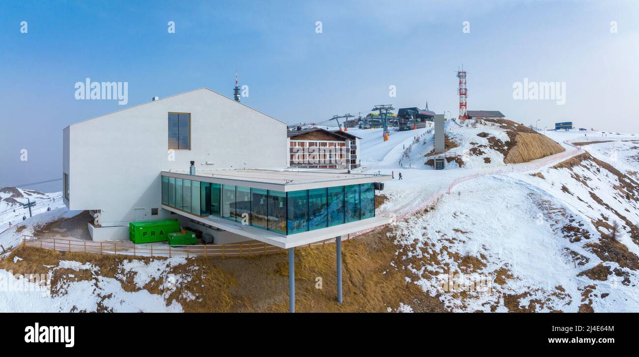Alpine restaurant and museum on snow covered mountain in alps against sky Stock Photo