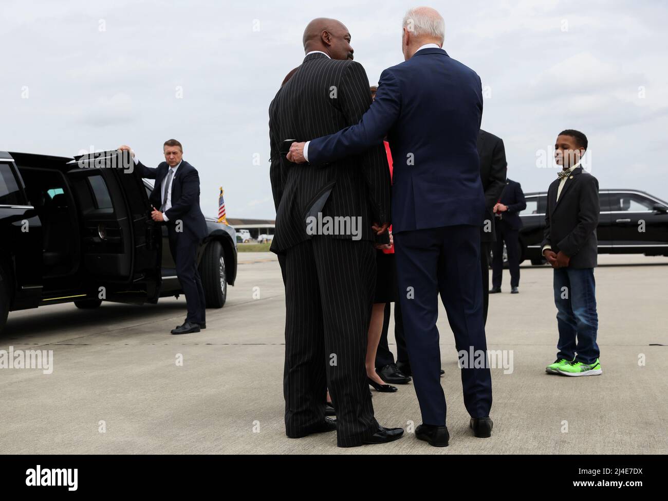 U.S. President Joe Biden greets Melvin “Skip” Alston, Chair of Guilford County Board of Commissioners, as he arrives at Piedmont Triad International Airport in Greensboro, North Carolina, U.S., April 14, 2022. REUTERS/Leah Millis Stock Photo