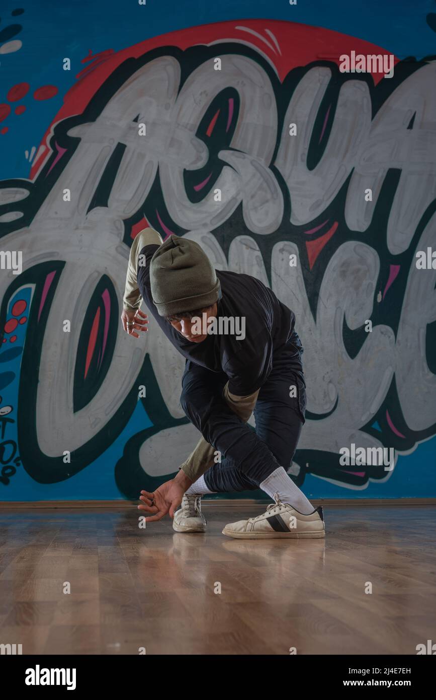 Modern rapper dancing in garage. Urban lifestyle, hip hop Stock Photo ...