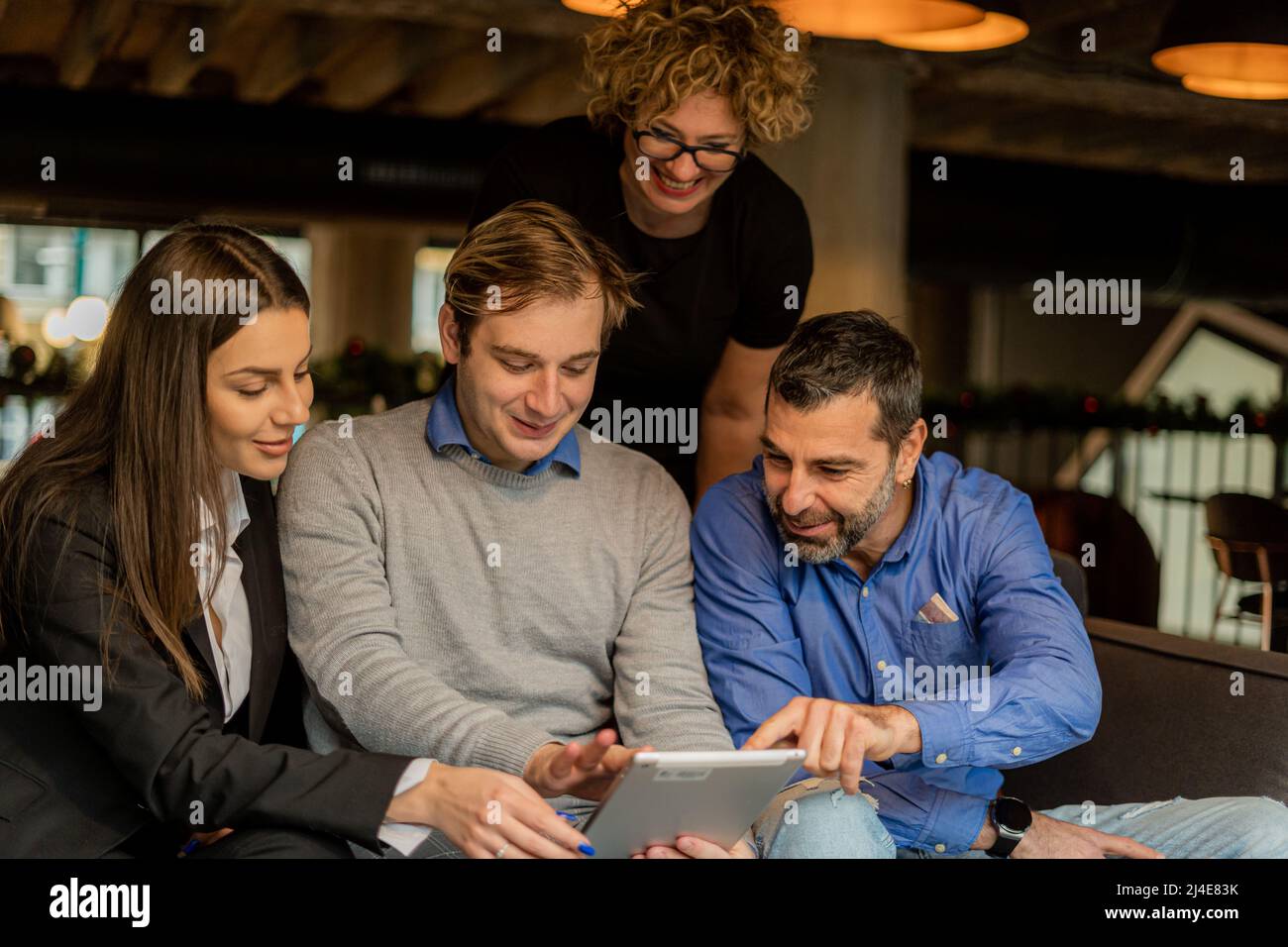 Four amazing business people are having a discission about the plans ...