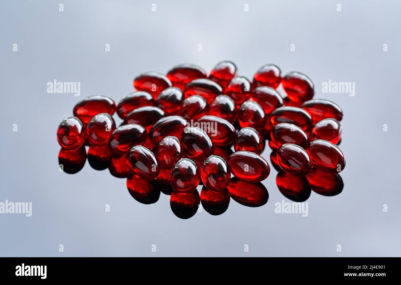 Krill oil pills - healthy nutritional supplement rich in omega-3 fatty acids and astaxanthin Stock Photo