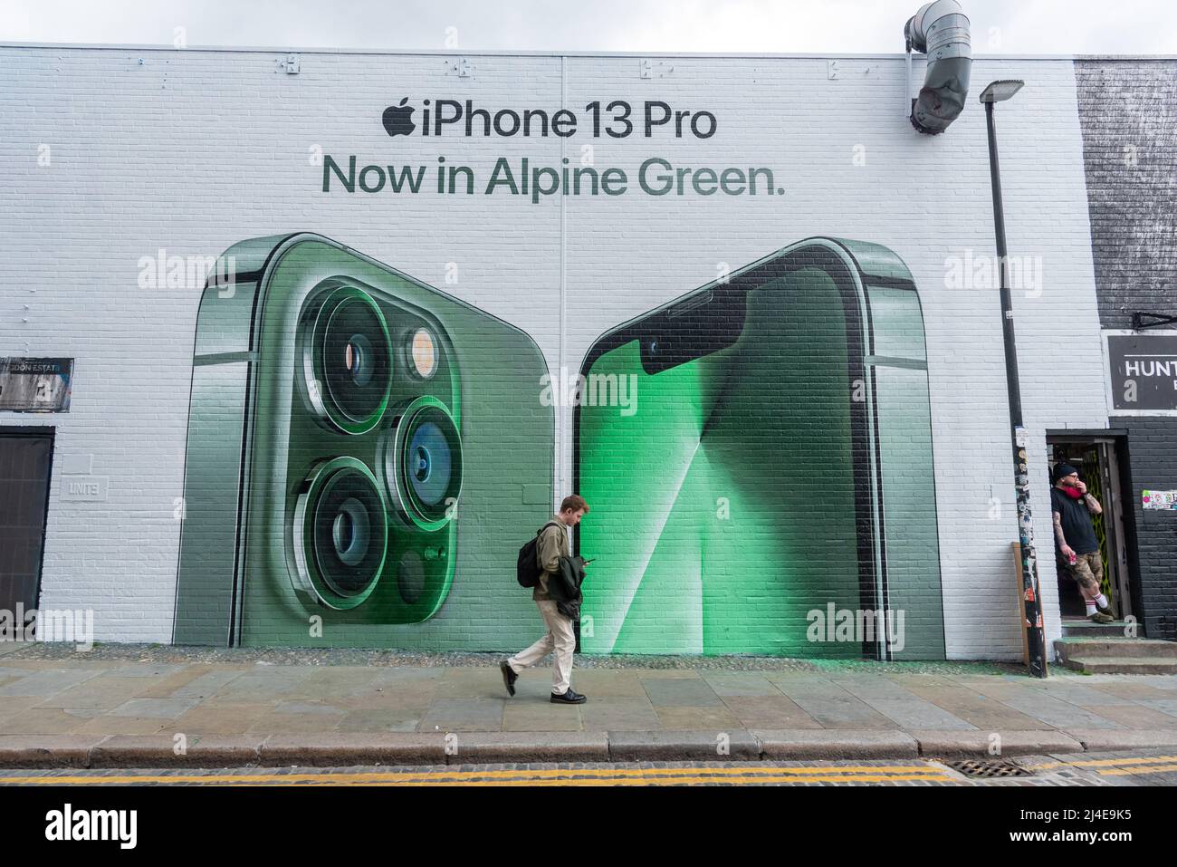 14/04/2022. London, UK. Photo by Ray Tang. A new Apple Pro 13 mural has been painted and unveiled in Shoreditch, East London today. The mural by EE mobile phone network features the new Alpine Green colour phone variant. Stock Photo