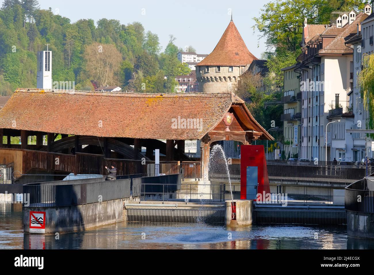 Lucerne, Switzerland - May 05, 2016: General view towards Spreuer Bridge and Nolliturn Tower of Musseg Wall  by the Reuss river in old town. These are Stock Photo