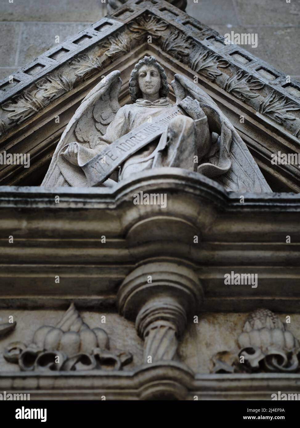 Statue of an angel on the facade of the church Stock Photo - Alamy