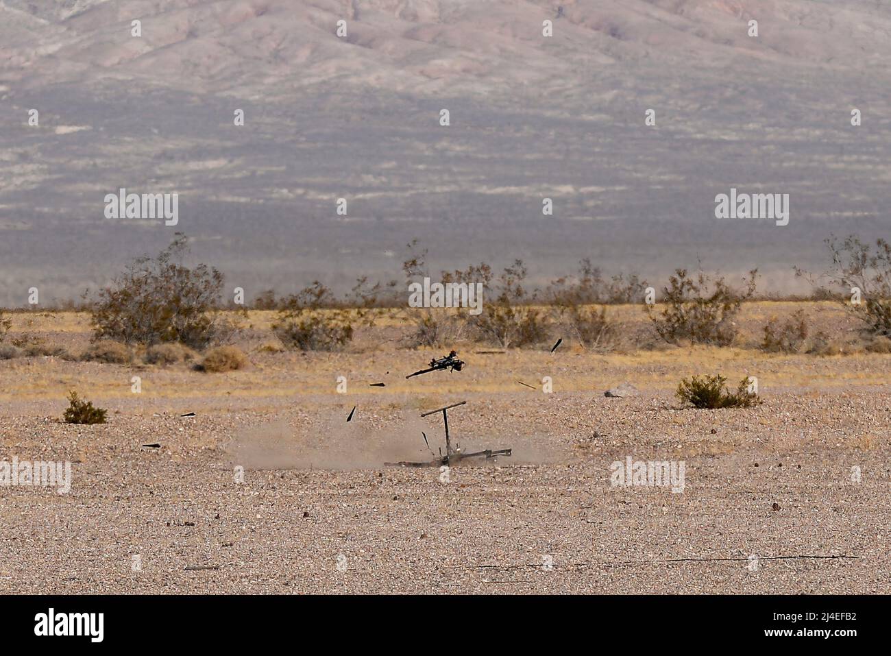 A  DJI S1000 drone crashes to the ground after being intercepted by an attack drone with attached net, part of the counter-unmanned aerial system developed by the team from Wright-Patterson Air Force Base, Ohio, during the 2016 Air Force Research Laboratory Commanders Challenge at the Nevada National Security Site, Las Vegas, NV., Dec. 13, 2016. Teams were given six months to develop a complete counter-unmanned aerial system to aid in base defense. In addition to the attack drone, Wright-Patterson's system uses a camera and laser range finder to detect UAS devices. (U.S. Air Force photo by Wes Stock Photo