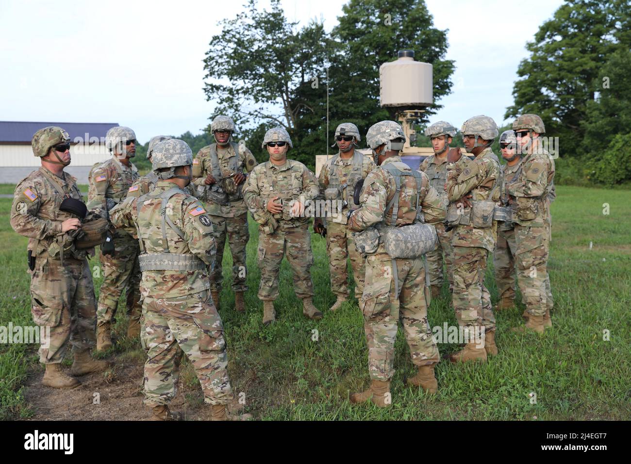 Counter Mortar Radar  - New York Army National Guard Soldiers with the 27th Infantry Brigade Combat Team review an upcoming training mission while fielding the new AN/TPQ-50 Lightweight Counter Mortar Radar (LCMR) on July 31, 2019, at Fort Drum, New York. The radar section for the 27th Infantry Brigade Combat Team took a course on the new radar system that was over a week long before testing in the field. ( U.S. Army National Guard photo by Sgt. Andrew Winchell ) Stock Photo