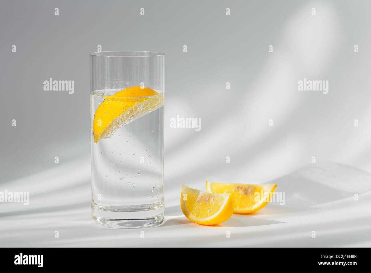 Glass of clean mineral sparkling water with ice and lemon Stock Photo ...