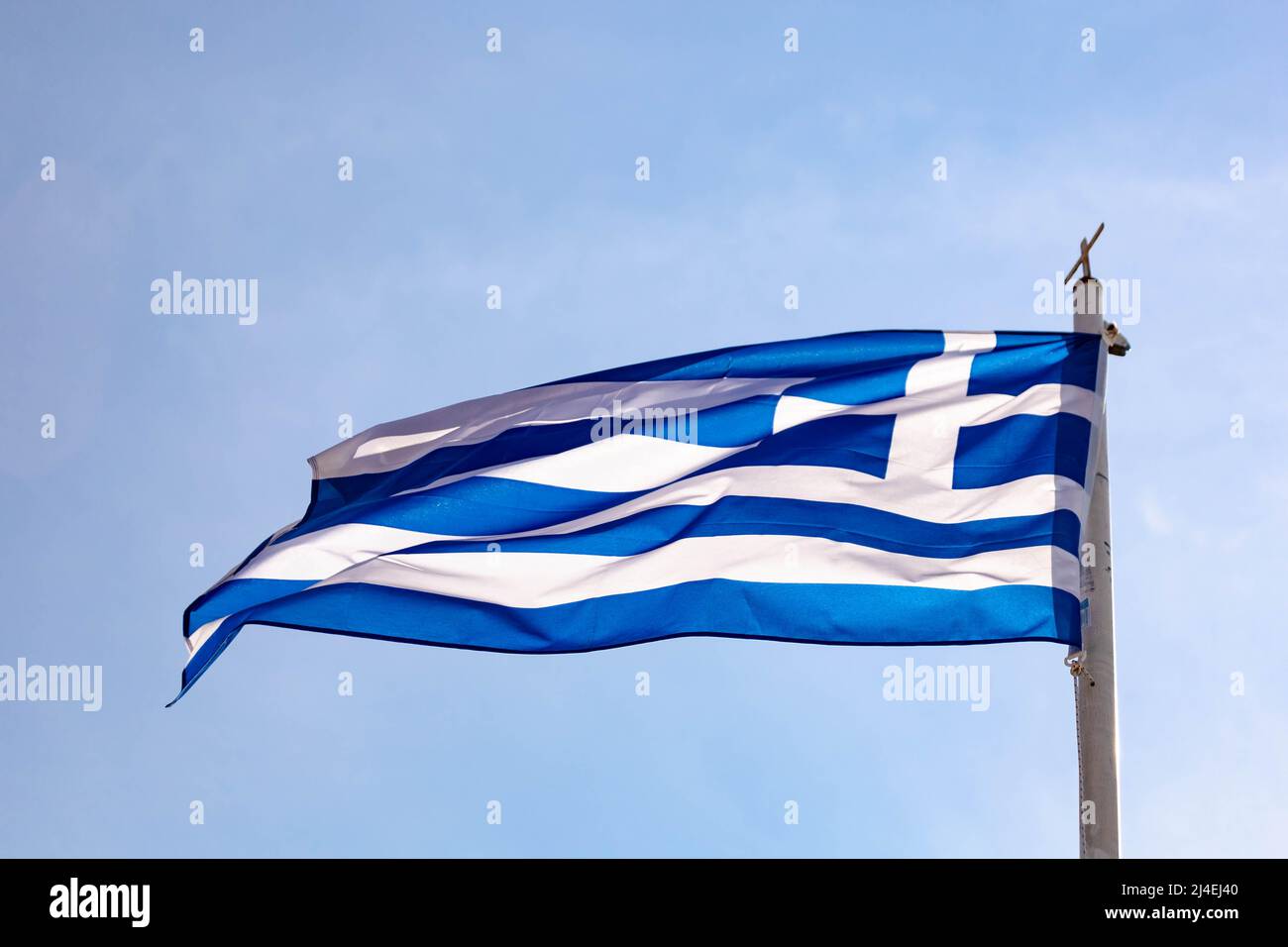 Greek flag waving in the wind. Summer vacation destinations Stock Photo