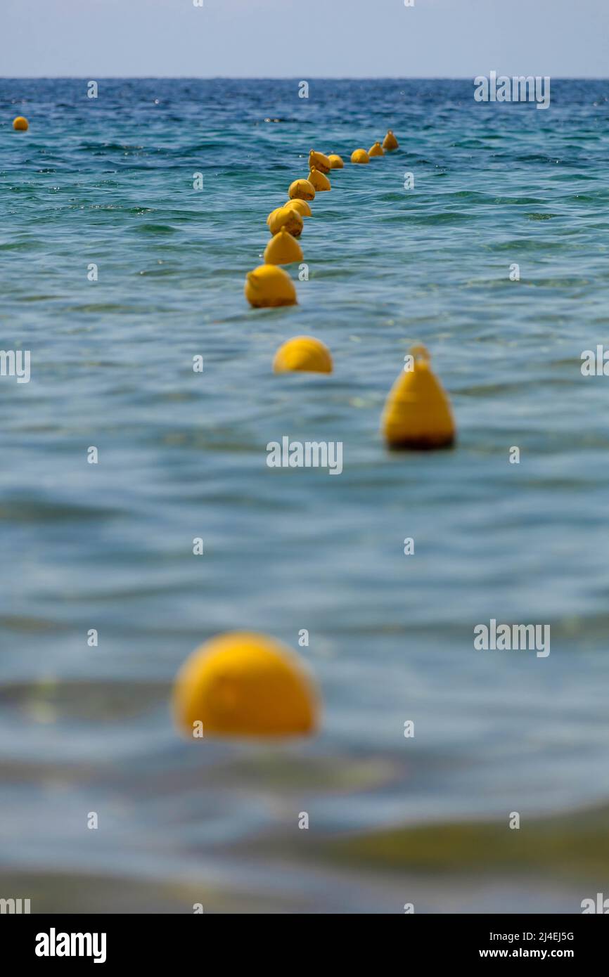 Safety sea buoys floating in the sea water. Stock Photo