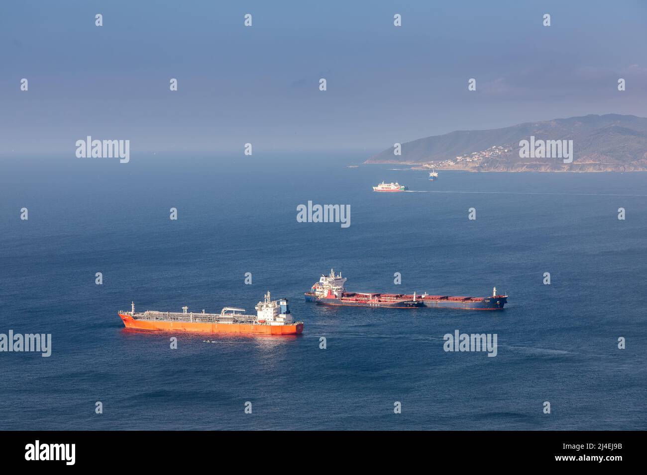 Shipping in the Bay of Gibraltar: LPG tanker Kallo in foreground, bulk carrier W-Ace behind Stock Photo